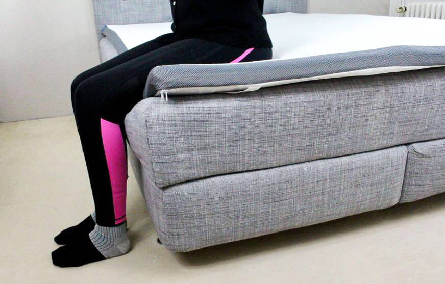 person sitting on the eazzzy topper